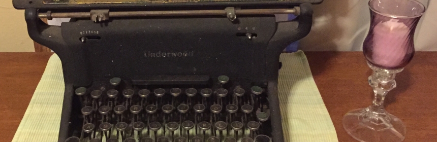Photo of 1930s Underwood typewriter next to a candle